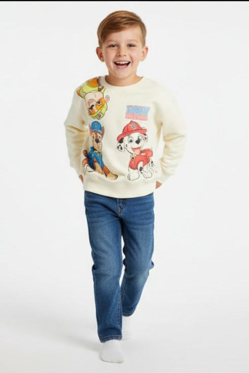 Child wearing a colorful sweater with Paw Patrol on a white background
