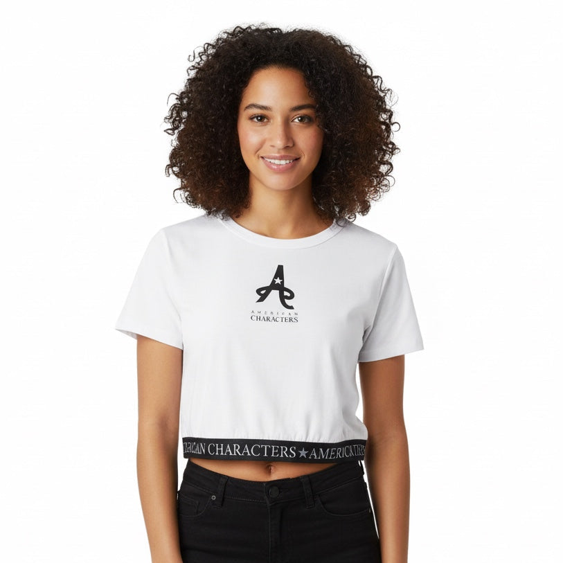 Person wearing a white t-shirt with a logo and text, standing against a white background