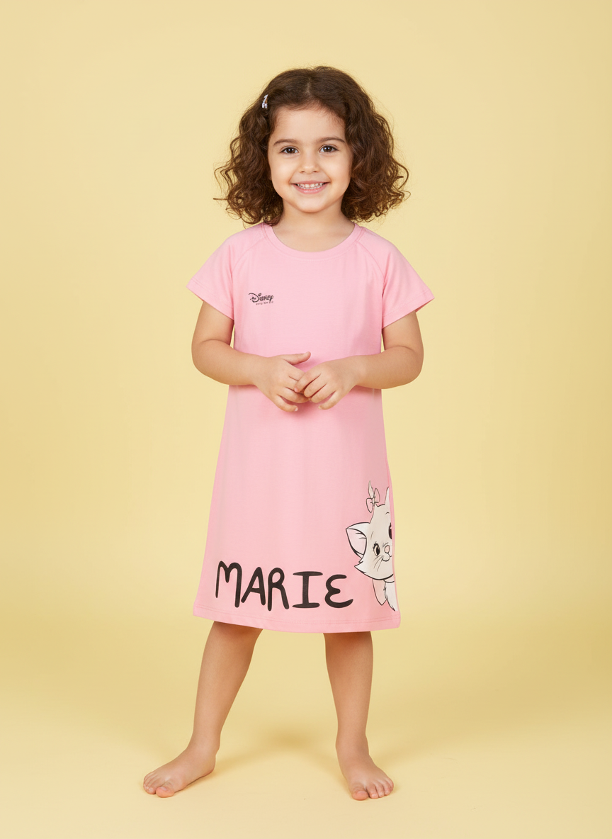Young girl wearing a pink dress with 'Marie' from Disney on a yellow background