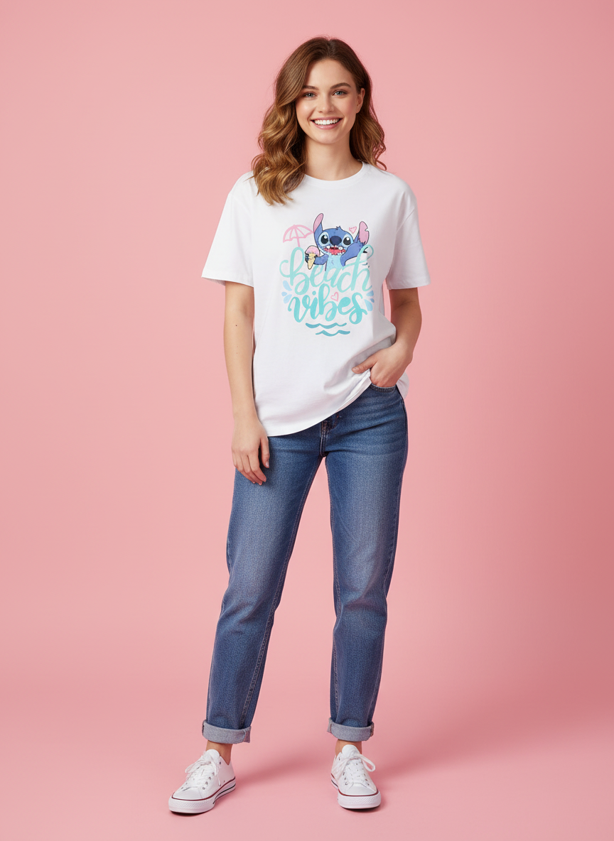 Woman wearing a white t-shirt with a Stitch from Disney graphic and beach vibes text on a pink background
